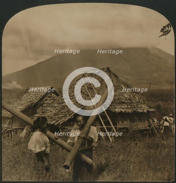 'Native girls with their singular water vessels made of long shafts of Bamboo, Philippine Islands',  Artist: Unknown.