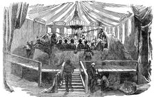Naturalists dining inside a model of a dinosaur, Crystal Palace, Sydenham, New Year's Eve, 1853. Creator: Unknown