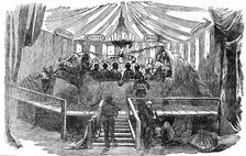 Naturalists dining inside a model of a dinosaur, Crystal Palace, Sydenham, New Year's Eve, 1853