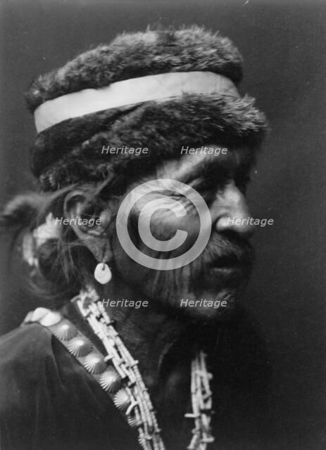 Navajo with fur cap, c1905. Creator: Edward Sheriff Curtis.