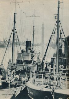 Naval Trawler, HMS Liffy alongside a Grimsby fishing vessel in Grimsby Docks 1937