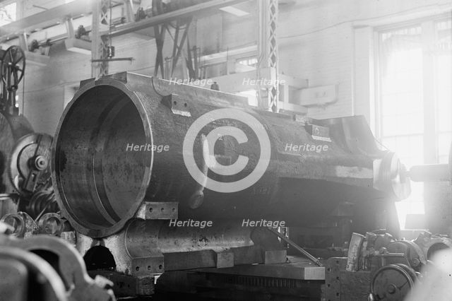 Navy Yard, U.S., Washington - 14 Inch Gun; Various Operations in Shrinking Jacket On It, 1917. Creator: Harris & Ewing.
