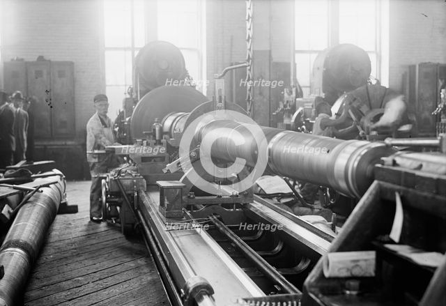 Navy Yard, U.S., Washington - Turning, Examining And Boring A 5 Inch, 50 Cal. Gun, 1917. Creator: Harris & Ewing.