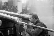 Navy Yard, U.S., Washington - Turning, Examining And Boring A 5 Inch, 50 Cal. Gun, 1917. Creator: Harris & Ewing