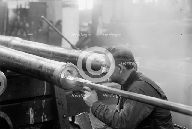 Navy Yard, U.S., Washington - Turning, Examining And Boring A 5 Inch, 50 Cal. Gun, 1917. Creator: Harris & Ewing.