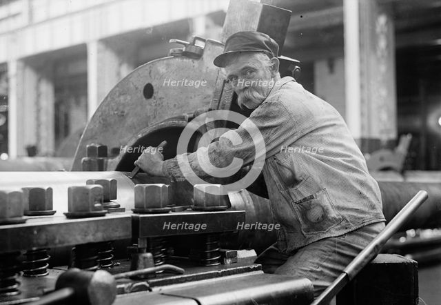 Navy Yard, U.S., Washington - Turning, Examining And Boring A 5 Inch, 50 Cal. Gun, 1917. Creator: Harris & Ewing.