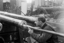 Navy Yard, U.S., Washington - Turning, Examining And Boring A 5 Inch, 50 Cal. Gun, 1917. Creator: Harris & Ewing