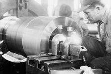 Navy Yard, U.S., Washington - Turning, Examining And Boring A 5 Inch, 50 Cal. Gun, 1917. Creator: Harris & Ewing