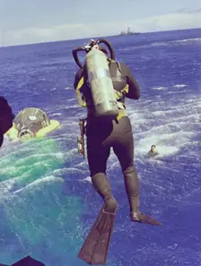 Navy diver leaps from helicopter, 1965. Creator: NASA