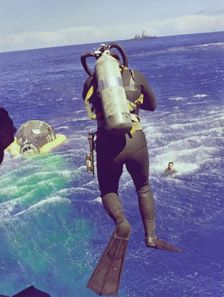 Navy diver leaps from helicopter, 1965. Creator: NASA