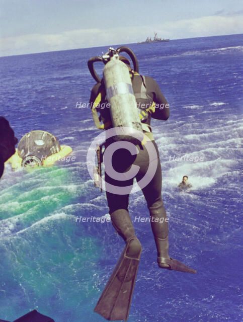 Navy diver leaps from helicopter, 1965. Creator: NASA.