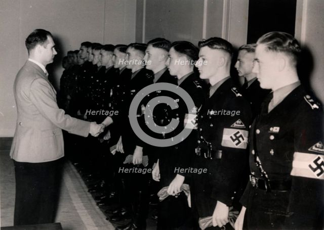 Nazi Deputy Führer Rudolf Hess meeting members of the Hitler Youth, Germany, January 1939. Creator: Unknown.