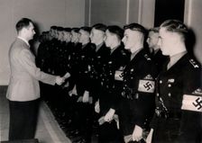 Nazi Deputy Führer Rudolf Hess meeting members of the Hitler Youth, Germany, January 1939. Creator: Unknown