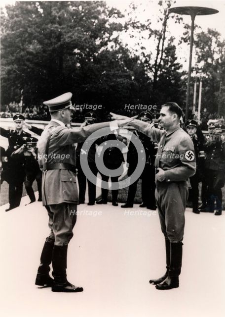 Nazi leaders Adolf Hitler and Rudolf Hess exchanging salutes, c1930s-c1940s. Creator: Unknown.