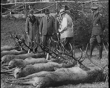 Nazi Officer Hermann Goering in Hunting Dress Showing His Colleagues a Line of Deer He Has..., 1931. Creator: British Pathe Ltd