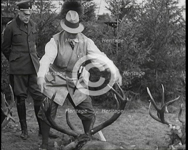 Nazi Officer Hermann Goering in Hunting Dress Showing His Colleagues a Line of Deer He..., 1931. Creator: British Pathe Ltd.