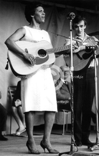 Nadia Cattouse and Martin Carthy, folk concert at Parliament Hill Fields, London, early 1960s.  Artist: Eddis Thomas