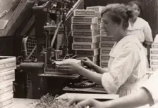 Nailing machine, Rowntree factory, York, Yorkshire, 1920