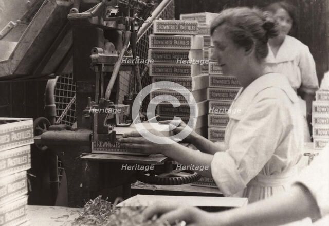 Nailing machine, Rowntree factory, York, Yorkshire, 1920. Artist: Unknown