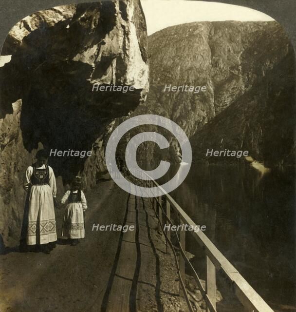 'Narrow rock-shelf where the road to Voring Falls past Lake Oifjord's deep waters, Norway', c1905. Creator: Unknown.