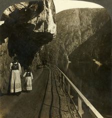 Narrow rock-shelf where the road to Voring Falls past Lake Oifjord's deep waters, Norway c1905. Creator: Unknown