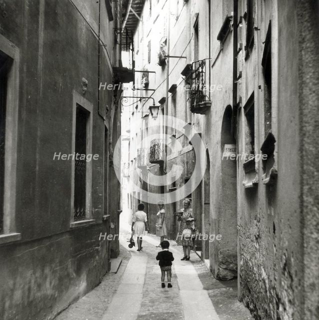 Narrow street in Orta San Giulio, Lake Orta, Italy, c1955.  Creator: Arthur Charles Kirby Ware.