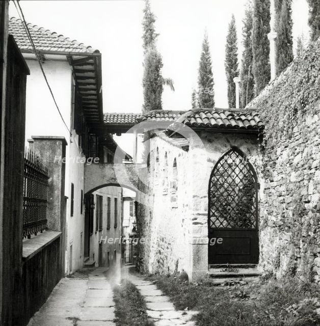 Narrow street, island of San Giulio, Lake Orta, Italy, c1955.  Creator: Arthur Charles Kirby Ware.
