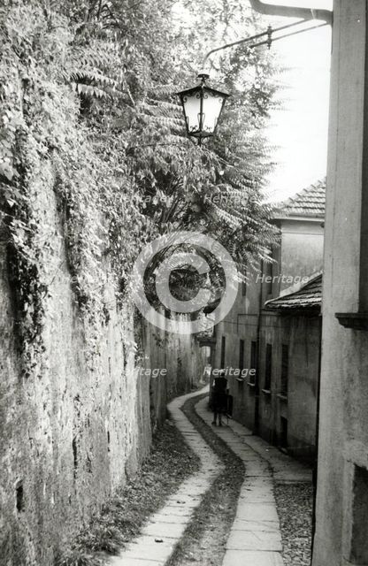 Narrow street, Orta San Giulio, Lake Orta, Italy, c1955.  Creator: Arthur Charles Kirby Ware.