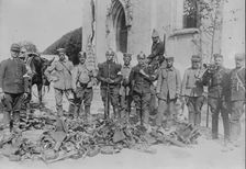 [Neufmont]iers, [F.], looking at battlefield booty, between c1914 and c1915. Creator: Bain News Service