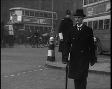 Neville Chamberlain, British Politician, Walking Across a London Street, 1937. Creator: British Pathe Ltd
