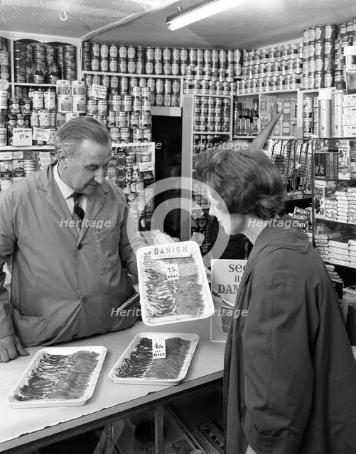 New metric system of selling bacon, Stocksbridge, Sheffield, South Yorkshire, 1966. Creator: Michael Walters.