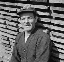 New England fisherman resting at the New York docks after unloading his cargo of fish, 1943. Creator: Gordon Parks