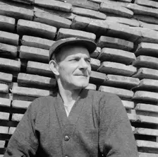 New England fisherman resting at the New York docks after unloading his cargo of fish, 1943. Creator: Gordon Parks