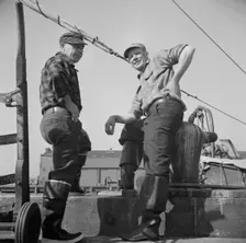 New England fishermen resting on the Fulton docks, New York, 1943. Creator: Gordon Parks