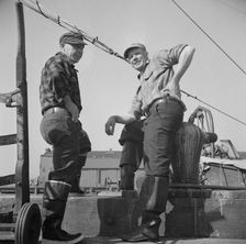 New England fishermen resting on the Fulton docks, New York, 1943. Creator: Gordon Parks