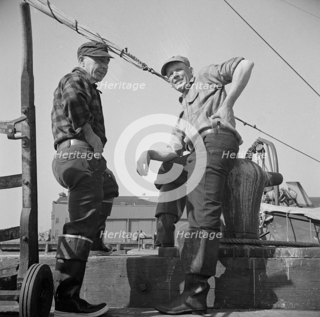 New England fishermen resting on the Fulton docks, New York, 1943. Creator: Gordon Parks.