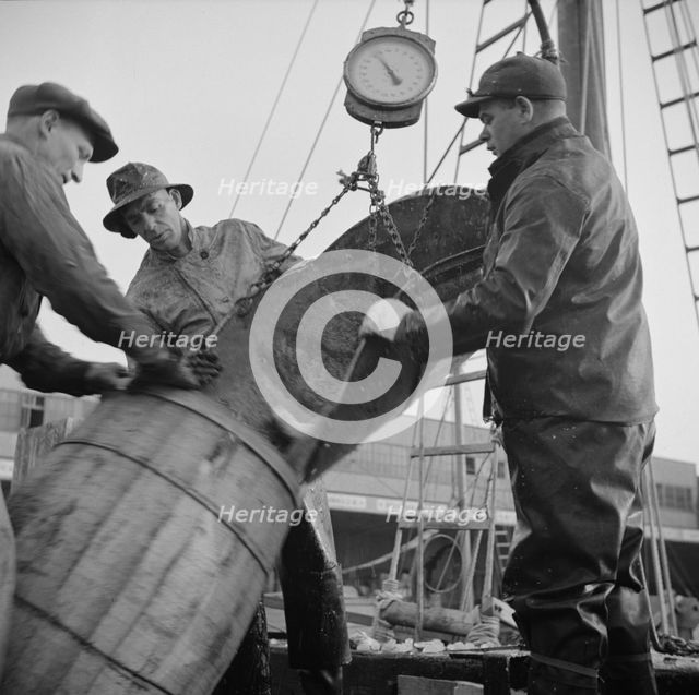 New England fishermen unloading fish at the Fulton fish market, New York, 1943. Creator: Gordon Parks.