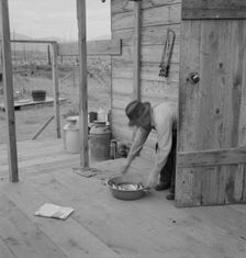 New settler shows fish he caught..., Priest River Valley, Bonner County, Idaho, 1939. Creator: Dorothea Lange