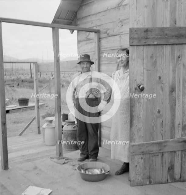 New settler shows fish he caught..., Priest River Valley, Bonner County, Idaho, 1939. Creator: Dorothea Lange.