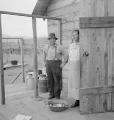 New settler shows fish he caught..., Priest River Valley, Bonner County, Idaho, 1939. Creator: Dorothea Lange