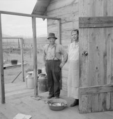 New settler shows fish he caught..., Priest River Valley, Bonner County, Idaho, 1939. Creator: Dorothea Lange