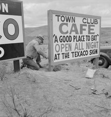New sign along highway advertises a new enterprise in the lonely town of Maupin, Oregon, 1939. Creator: Dorothea Lange