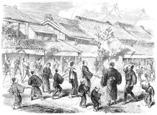 New-Year's Day in Japan - game of battledore and shuttlecock in the streets of Yokohama, 1865. Creator: Unknown