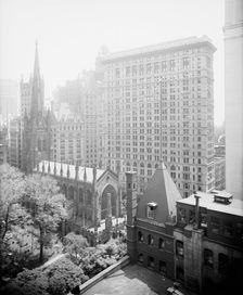 New York, N.Y., Trinity churchyard and the skyscrapers, between 1900 and 1920. Creator: Unknown