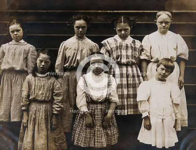 New York State Institute: a group of girls with Down's syndrome, standing on some steps, 1902. Creator: Unknown.