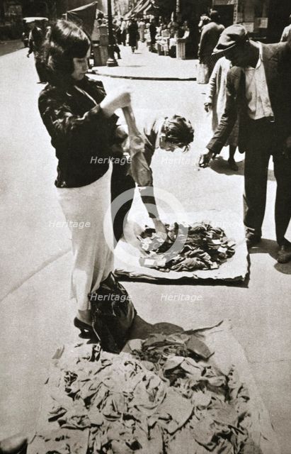 New York street trader selling stockings, USA, c1920s-c1930s. Creator: Unknown.
