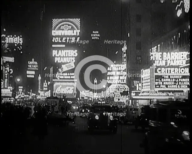New York Times Square at Night Lit up By Lights, 1920s. Creator: British Pathe Ltd.