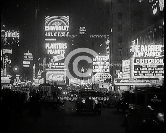 New York Times Square at Night Lit up By Lights, 1920s. Creator: British Pathe Ltd.