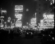 New York Times Square at Night Lit up By Lights, 1920s. Creator: British Pathe Ltd