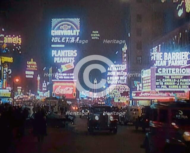 New York Times Square at Night Lit up By Lights, 1920s. Creator: British Pathe Ltd.